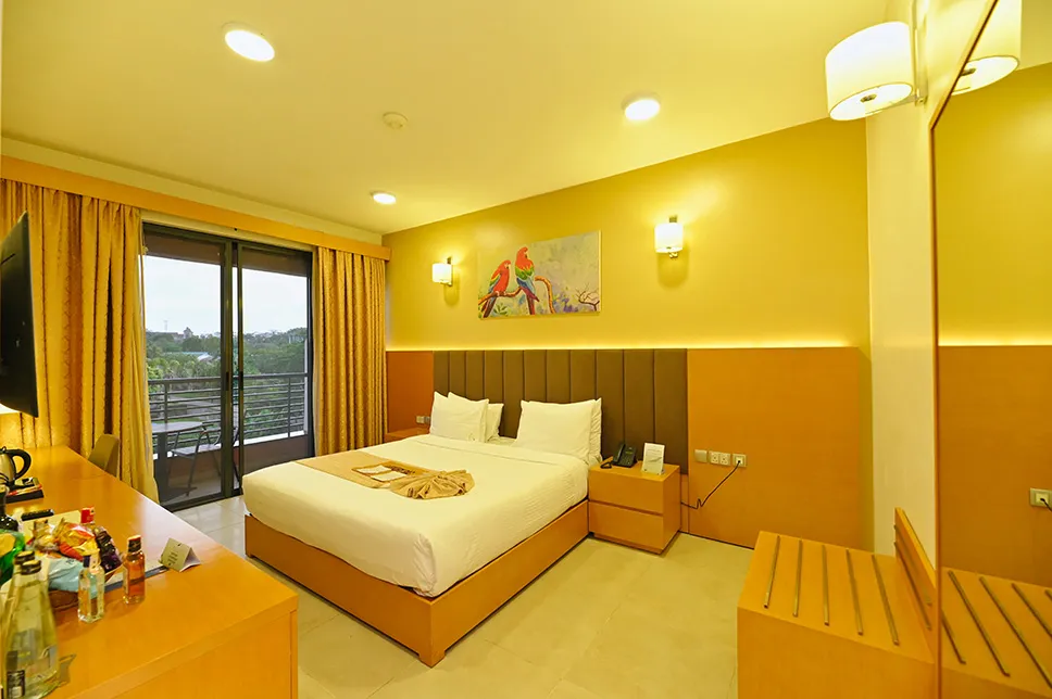 Classic Room at K Hotels Entebbe with king bed and private balcony